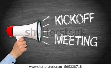Kickoff Meeting - megaphone with female hand and text Royalty-Free Stock Photo #565338718