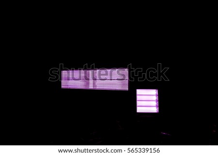 purple rectangle with effect gradient and purple square arranged horizontally on a black background, close-up of movie illumination, abstract geometric objects on black background