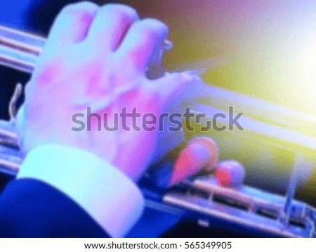 abstract blurred image. Actor trumpeter musician plays the trumpet. Musician plays a musical instrument on the concert stage.                               