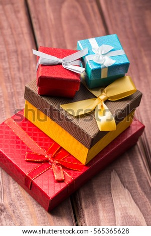 gift box with gifts for friends and loved ones for the holidays on a wooden background  
