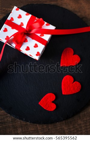 Valentine  Day card with red hearts, gift box with red ribbon and place for text. Valentines Day concept Background for design
