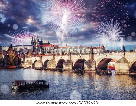 Fantastic views of the Charles Bridge. The beauty of the sky. Brightly Colorful Fireworks. Czech Republic. Photo greeting card. Bokeh light effect, soft filter. 