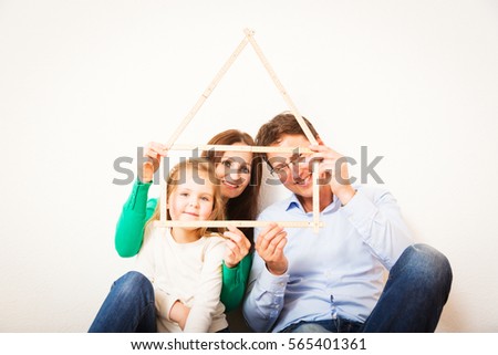 Family Of Three With House Shape