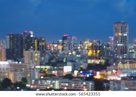 Blurred bokeh light office building with twilight sky background