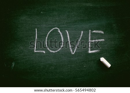 Abstract Chalk on blackboard with word love. texture valentine day or graphic design.