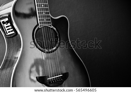 Beautiful acoustic guitar with equalizer in color black and white with 6 strings.