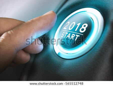Hand pressing a 2018 start button. Concept of new year, two thousand eighteen. Composite between a photography and a 3D background. Horizontal image Royalty-Free Stock Photo #565512748