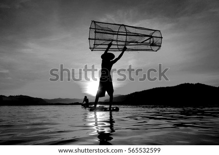 People fishing in river in Thailand. Black and white picture and silhouette.
