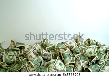 Cash dollars in various denominations on the plane. Royalty-Free Stock Photo #565538908