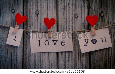inscription i  love you on white paper hanging on a rope with clothespin