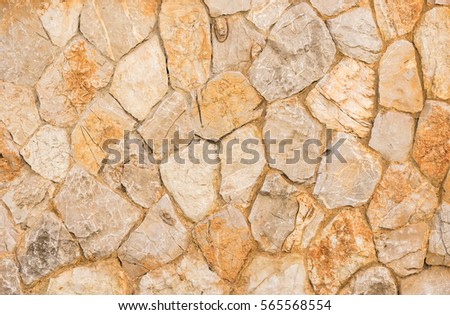 Natural stone wall background texture gray and brown.