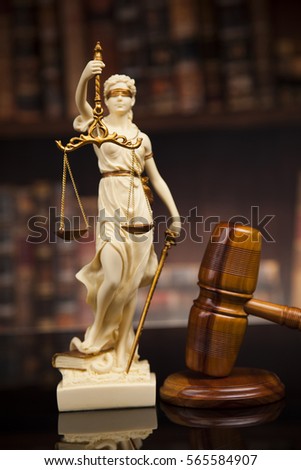 Judge gavel and scales of justice and book background