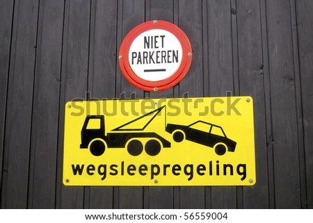 Dutch tow away sign on a garage door in Holland