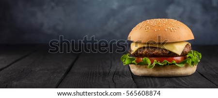 fresh and delicious Burger closeup on wooden background