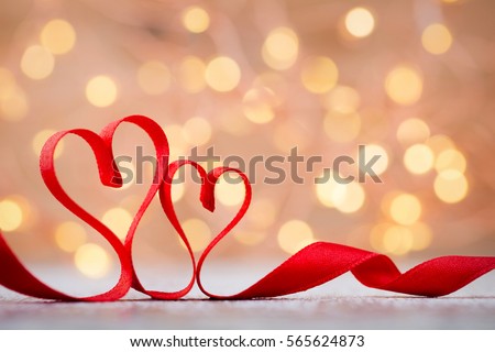 Two red hearts of ribbon. Valentines day greeting card.