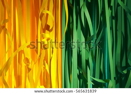 Colorful Paper Streamers Background. Green and Yellow Carnival Party Serpentine Decoration.