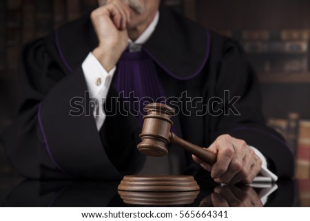 Courtroom, Judge, male judge in black mirror background Royalty-Free Stock Photo #565664341