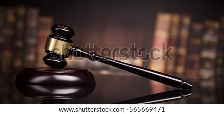 law theme, mallet of the judge, justice scale, books, wooden desk