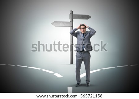 Businessman in difficult choice concept