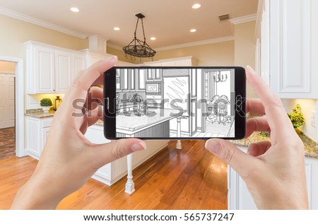 Hands Holding Smart Phone Displaying Drawing of Custom Kitchen Photo Behind.
