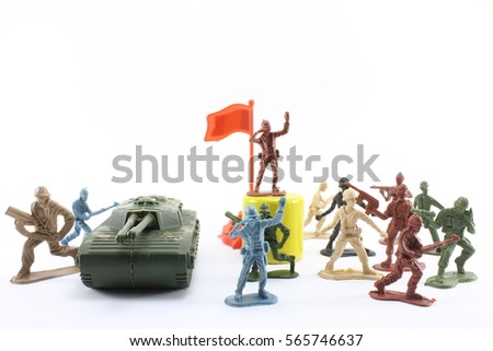 Plastic soldiers in battle on a white background