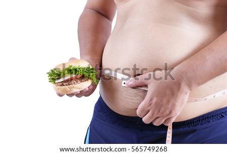 fat man hold hamburger and measure waist , loss weight