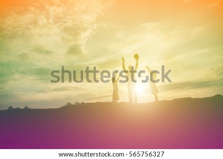 Happy family dancing on the road in the sunset time. Evening party on the nature

