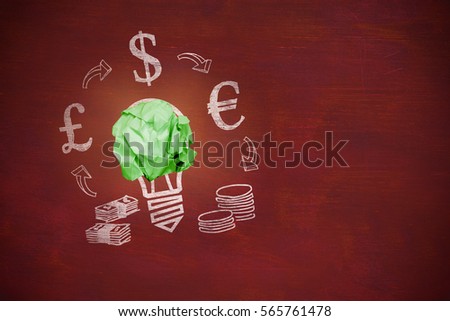 Digitally composite image of green crumpled paper against image of a desk