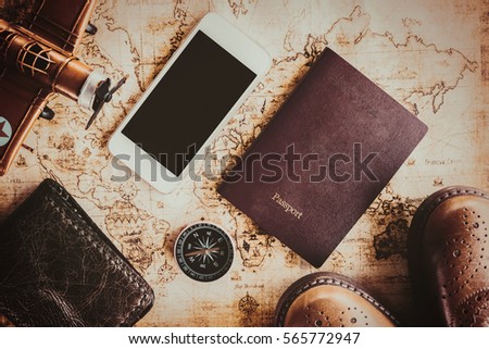 Overhead view of Traveler's accessories, Essential vacation items, Travel concept background, vintage background, love story, selective focus, go to see the world, save money for travel
