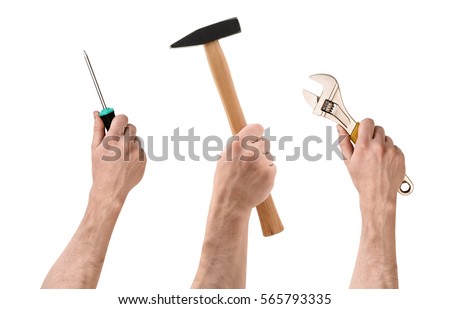 Three hands with screwdriver, hammer, and wrench on white background. Handmade and DYI. Manual labor. Building and repair. Royalty-Free Stock Photo #565793335