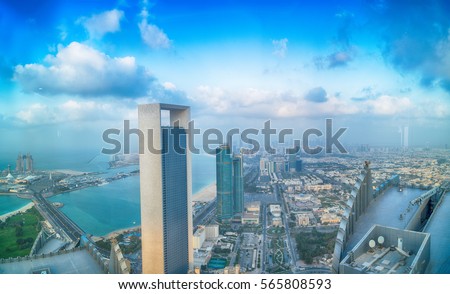 ABU DHABI, UAE - DECEMBER 8, 2016: Panoramic sunset city skyline. Abu Dhabi attracts 10 million people annually. Royalty-Free Stock Photo #565808593