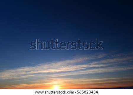 Light sunset twilight in clear blue winter sky