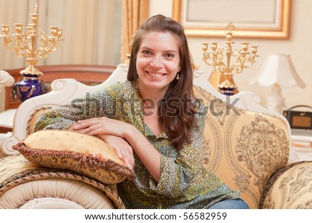 beautiful young woman in a luxurious interior