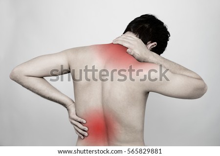 young man having a pain in his neck and back