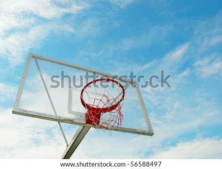 Outdoor basketball hoop on a blue sky background