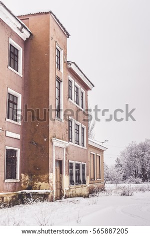 Old abandoned building of Soviet Union times covered snow