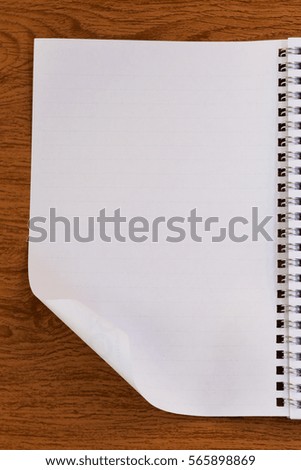 The white paper notes on the wooden floor.