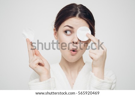 woman with a sponge wihte background cotton pad problem skin Royalty-Free Stock Photo #565920469