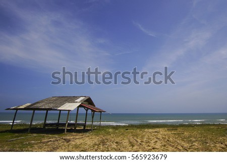 Seaside, hut and bright skies