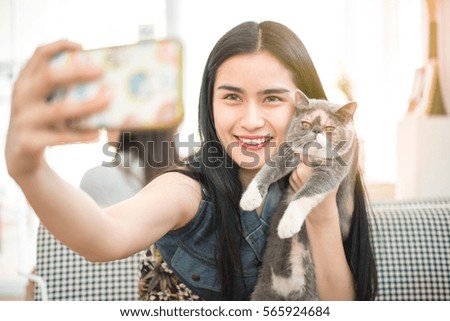 Beautiful girl taking selfie and Cute Kitten