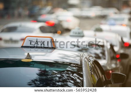 Taxi stand in a row on a city street.