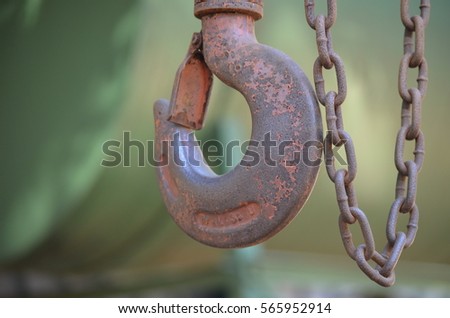 Metal hook hanging from a chain