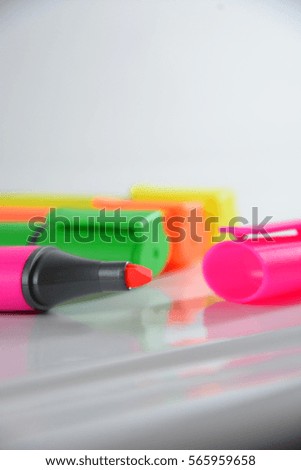 Yellow, orange, green and pink markers