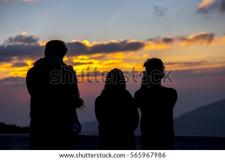 People on top of a mountain waiting for take photo with light Twilight.