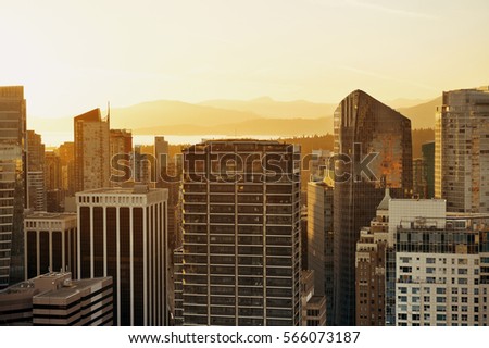 Vancouver rooftop view with urban architectures at sunset.