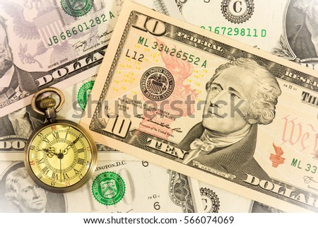 watch on dollar banknotes,  Time is money concept,Business concept, Analog hours on a heap of paper dollars, 