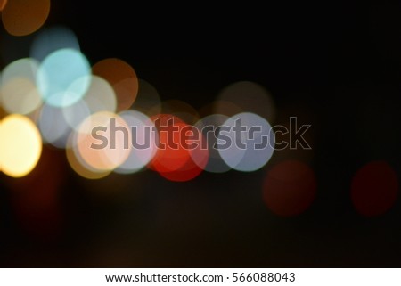 Out of focus of many color of lights in the cold night at the city in blurred light background