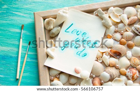 do what you love, love what you do motivational word abstract paintbrushes scattered shells, creativity concept