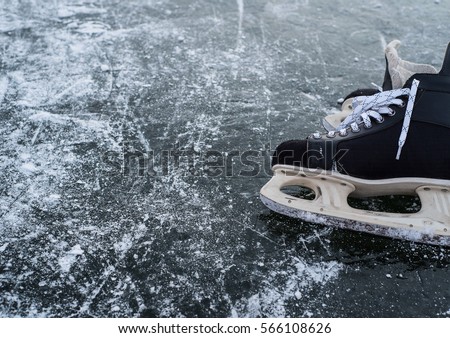 hockey skates on ice pond river