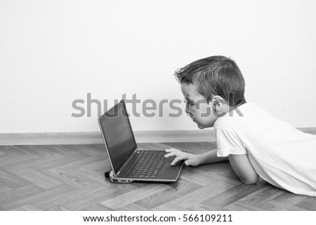 boy working on a laptop, computer generation,black and white photography